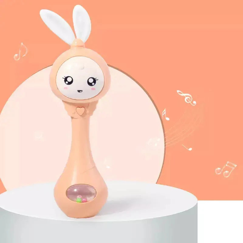 https://cdn.shopify.com/s/files/1/0587/4198/1376/products/coelhito-baby-chocalho-musical-criativo-ic-3-criativae-laranja-658987.webp?v=1688067657